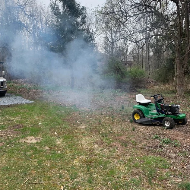 lawn mower blowing white smoke