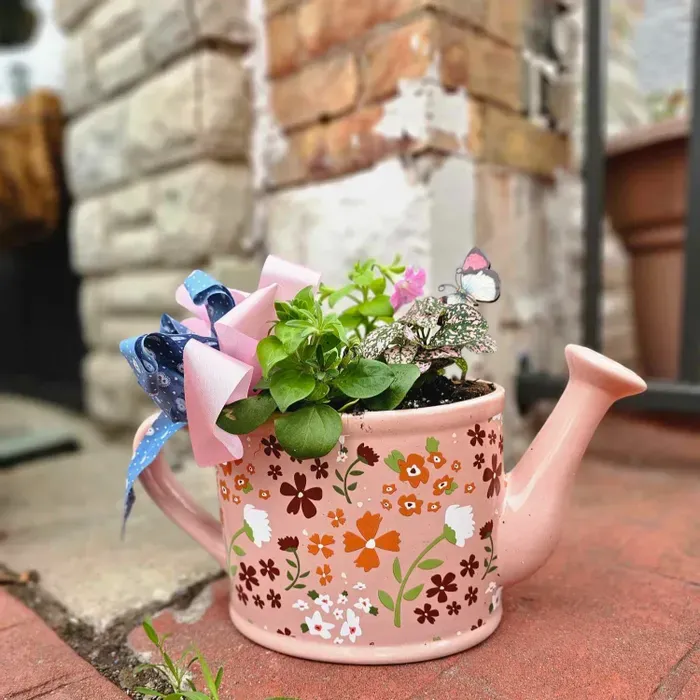 watering can with flowers